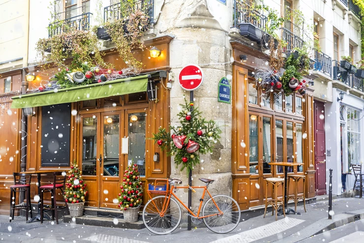 typical Parisian cafe decked out for christmas and the perfect spot to have a vin chaud or cafe chaud