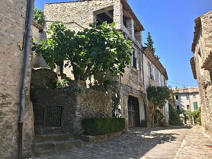 stony cobbled street and houses in Vaison-la-Romaine in Provence France