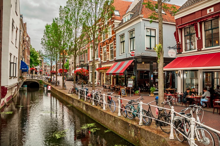 a picturesque canal in Delft in the Netherlands