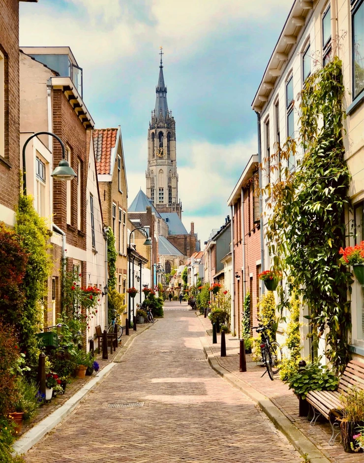cobbled street in Delft with the New Church in the background
