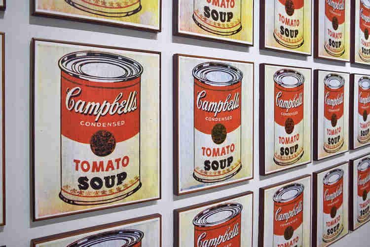 Warhol’s famous Campbell’s Soup paintings, which gave him his first break