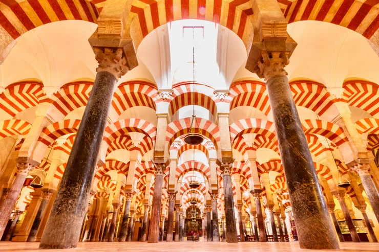 a forest of candy cane arches in the Mezquita in Cordoba
